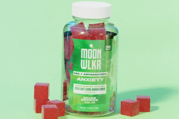 Bottle of MoonWlkr CBD + Ashwagandha Anxiety Gummies with red cubes