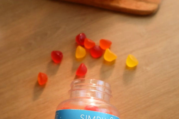CBD gummies spilled on a wooden surface
