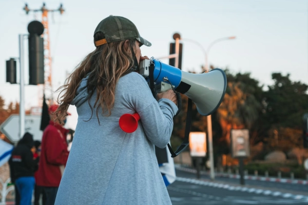 Person using a megaphone at a peaceful protest