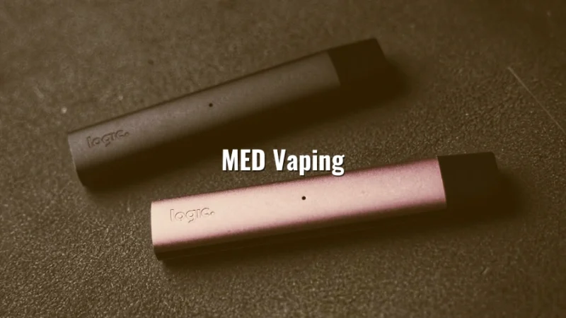 Close-up of two sleek vape devices on a table with the words “MED Vaping”
