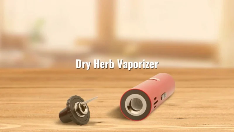 Red dry herb vaporizer opened on a wooden surface with mouthpiece detached, background softly blurred with text “Dry Herb Vaporizer”