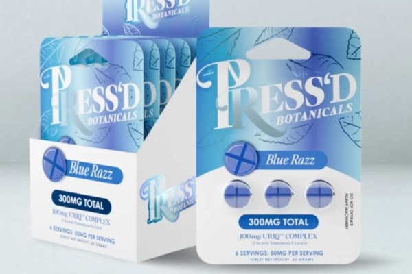 Press’d Botanicals Blue Razz tablets in resealable packaging with tablets displayed in front