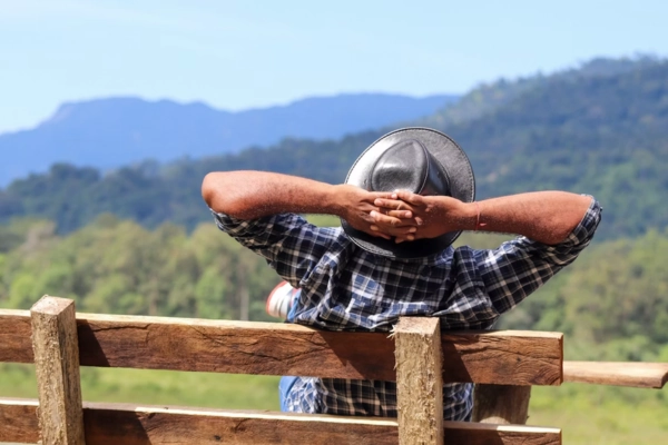 Person relaxing outdoors while enjoying a calm moment associated with wellness-focused.